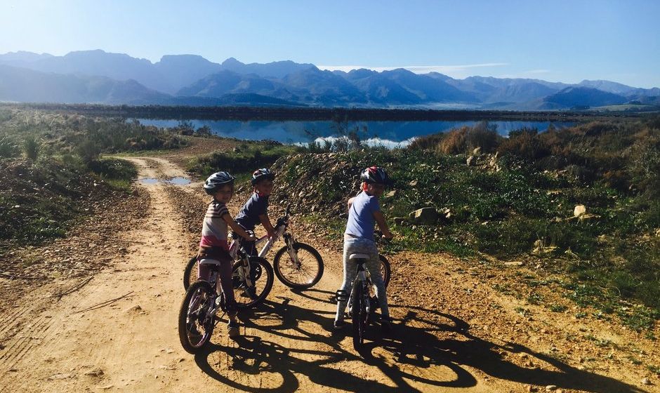 Children cycling bikes South Africa